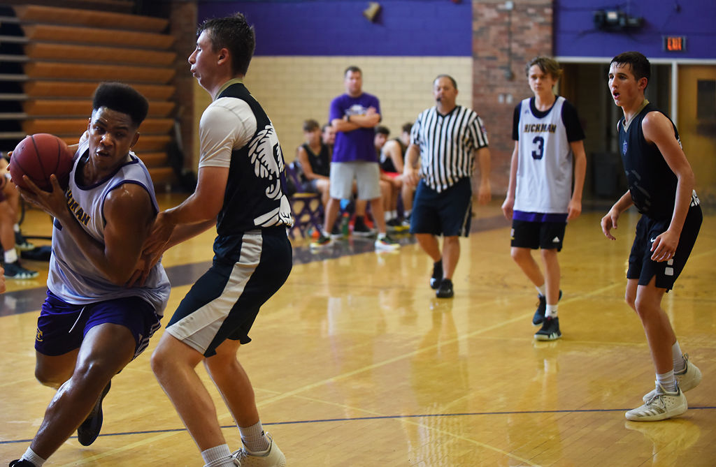 Roman Canty pushes through the defender towards the basket